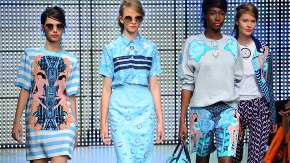 Models in blue stride down the catwalk at the Holly Foulton fashion show