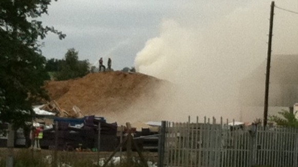 Firefighters working to control the fire at the recycling plant in Stanton-by-Dale