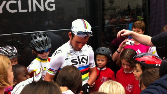 Cyclist Mark Cavendish meets pupils from Reigate Priory Junior School.
