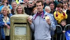 Andy Murray standing next to his gold painted post box during a walkabout in Dunblane