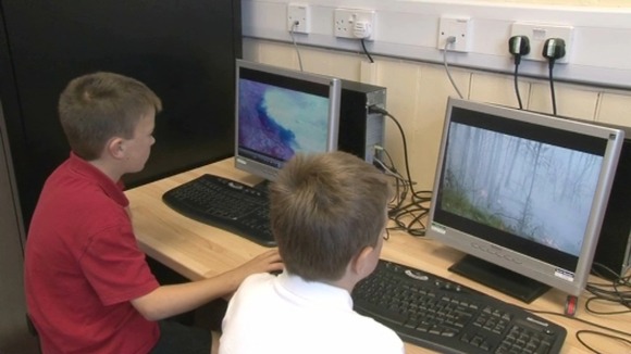 Boys at computer screens