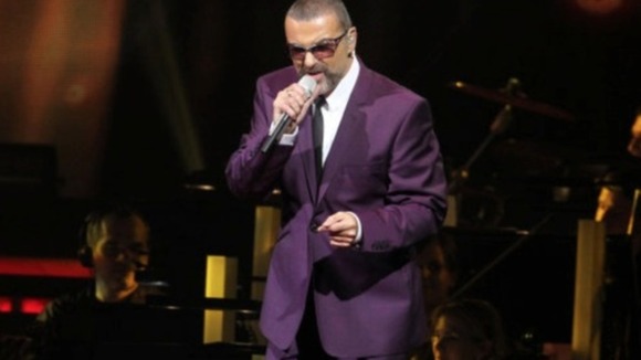 George Michael performs during his 'Symphonica' tour in Vienna