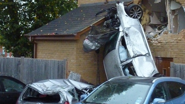 Car crashes into house.