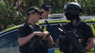 Police outside the Oxney Road travellers' site on the outskirts of Peterborough.