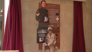 The plaque unveiled at Warrant Officer Kim Hughes' old school