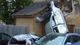 Car crashes into house.