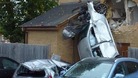 Car crashes into house.