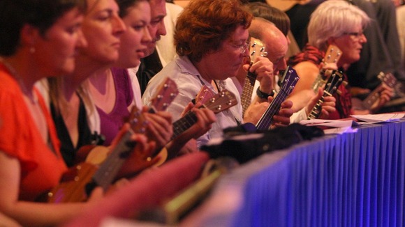 Members of the public play along with the Ukulele Orchestra of Great Britain, at the Royal Albert Hall, in Kensington, west London.