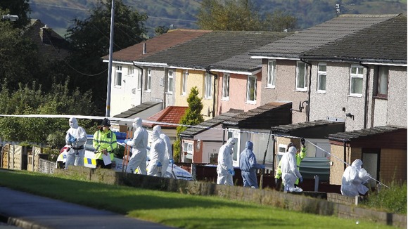 Forensic officers at the scene close to where police constables Fiona Bone, 32, and Nicola Hughes, 23, where killed in Hattersley
