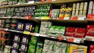 Supermarket shelves stacked with beer