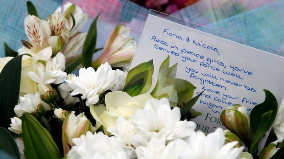A card that reads:"Rest in peace girls, you've served your force well. You will never be forgotten."