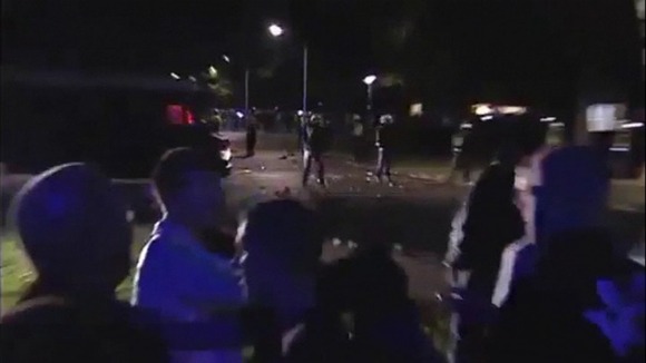 Riot police break up crowds of violent youths in Haren.