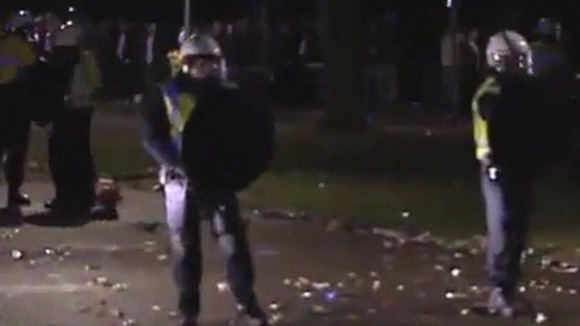 Riot police break up crowds of violent youths in Haren.