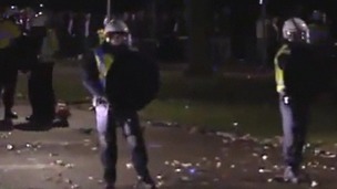 Riot police break up crowds of violent youths in Haren.