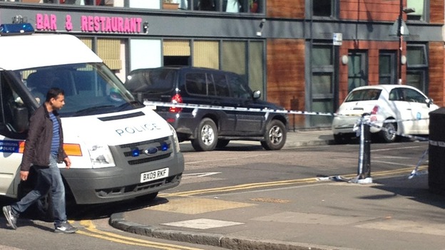 Police teams cordon off the street where German Gorbuntsov was shot on Tuesday evening.