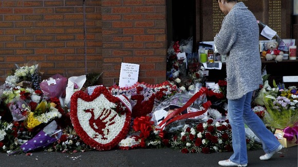 Tributes left at the Hillsborough Memorial outside the football ground at Anfield, Liverpool.