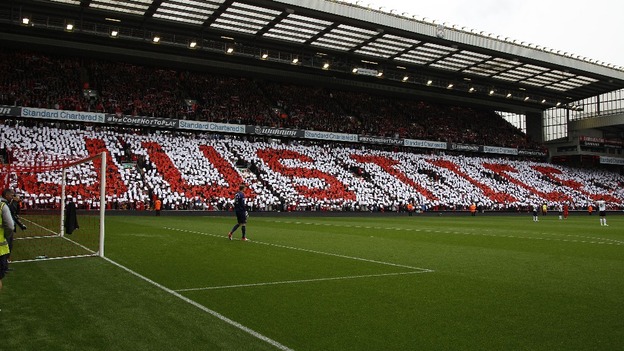 Supporters hold up coloured cards in memory of the Hillsborough disaster at Anfield in Liverpool.