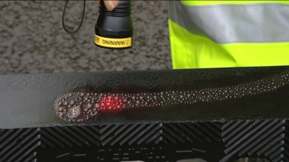 Special grease being used to mark drain covers