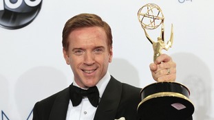 Damian Lewis holds up the award for outstanding lead actor in a drama series