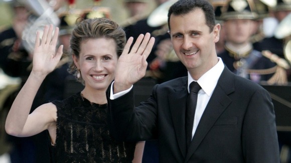 President Bashar al-Assad and his wife Asma arrive for a formal dinner in Paris in 2008