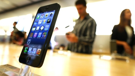 An iPhone 5 is displayed in an Apple store in central Sydney shortly after going on sale to the public on Friday