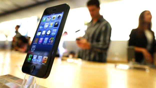 An iPhone 5 is displayed in an Apple store in central Sydney shortly after going on sale to the public on Friday