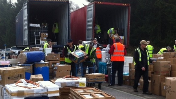 Workers loading water pumps in Derby