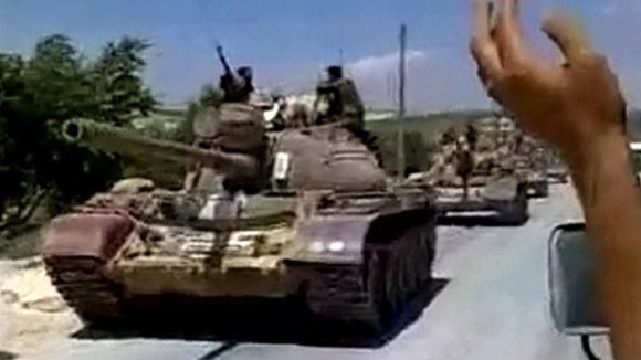 Tanks roll through Homs at the start of Feb