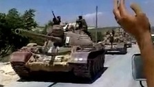 Tanks roll through Homs at the start of Feb