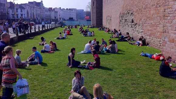 Sunbathers outside Cardiff Castle