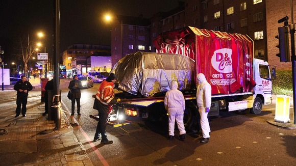 A Fiat Stilo, where Kirsty Treloar, 20, was found stabbed to death, is removed from Ryder Mews in Hackney, east London.