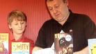 father and son opening cards