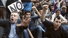 Protesters shout slogans during a demonstration outside Madrid's Parliament
