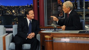 Prime Minister David Cameron (left) talks with talk show host David Letterman.