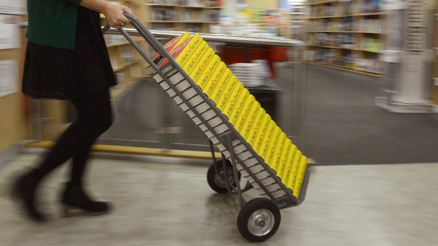 Scores of books are readied for the shelves.
