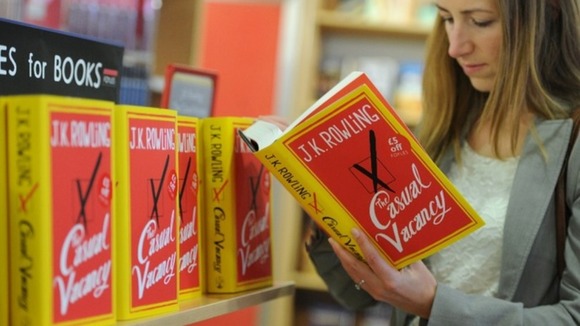 A customer reads JK Rowling's new novel.