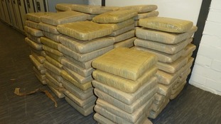 Just some of the hundreds of tape-wrapped packages containing cannabis.