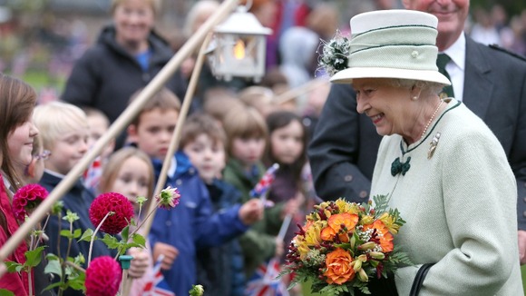 The Queen talks to local children, in Ballater