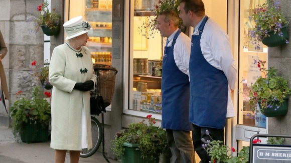 The Queen talks to the local butchers, in Ballater 