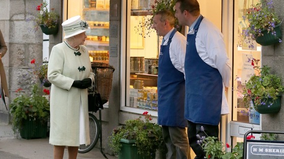The Queen talks to the local butchers, in Ballater