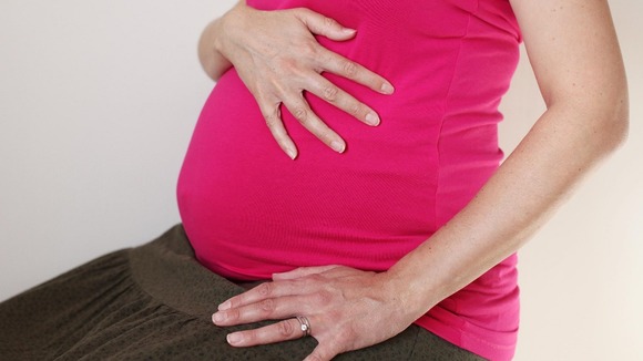 A pregnant woman.