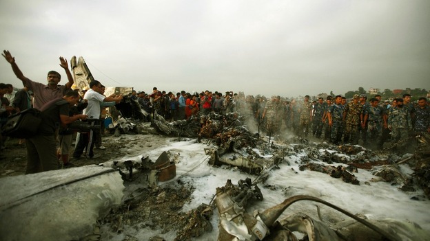 The fire is extinguished by rescue teams.