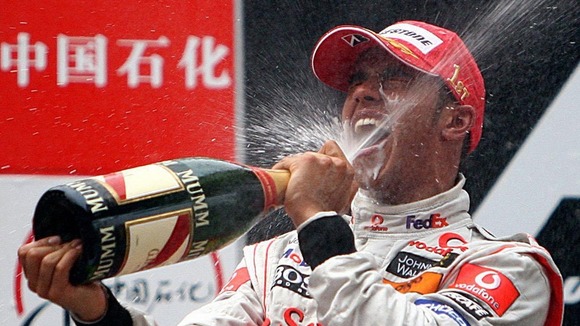 The racer celebrates winning the Formula One World Drivers' Championship (WDC) in 2008 with McLaren.
