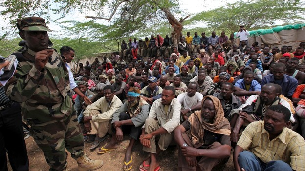 Members of militant group al Shabab are paraded at Maslah square after their surrender in Mogadishu