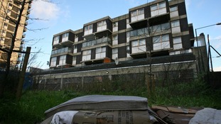 A mattress lies next to similar ones on a patch of wasteland on the corner of Commercial Street and Pomell Street in Tower Hamlets.