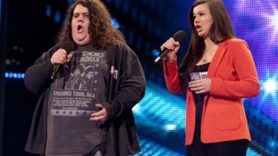 Contestants Jonathan and Charlotte singing