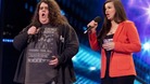 Contestants Jonathan and Charlotte singing