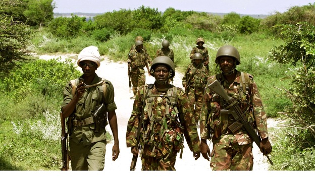 A team of Kenyan Defence Forces and Somali Transitional Federal Government soldiers patrol the Indian Ocean coastline