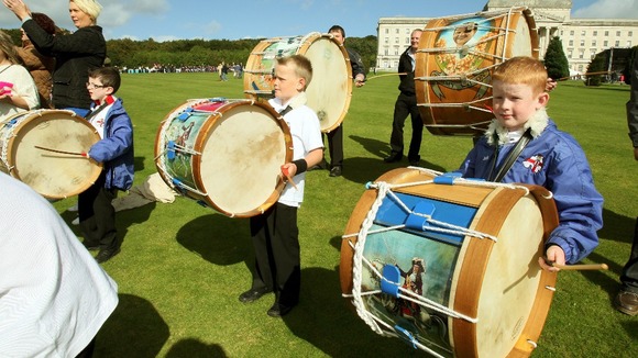 Young Lambeg drummers welcomed Orange Order members as they arrived at Stormont in Belfast.
