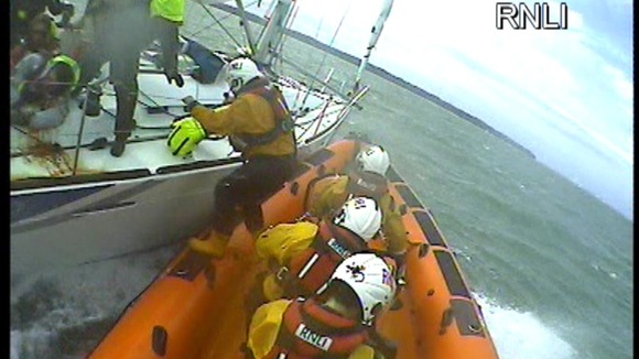 First aider crosses to yacht to assist in rescue